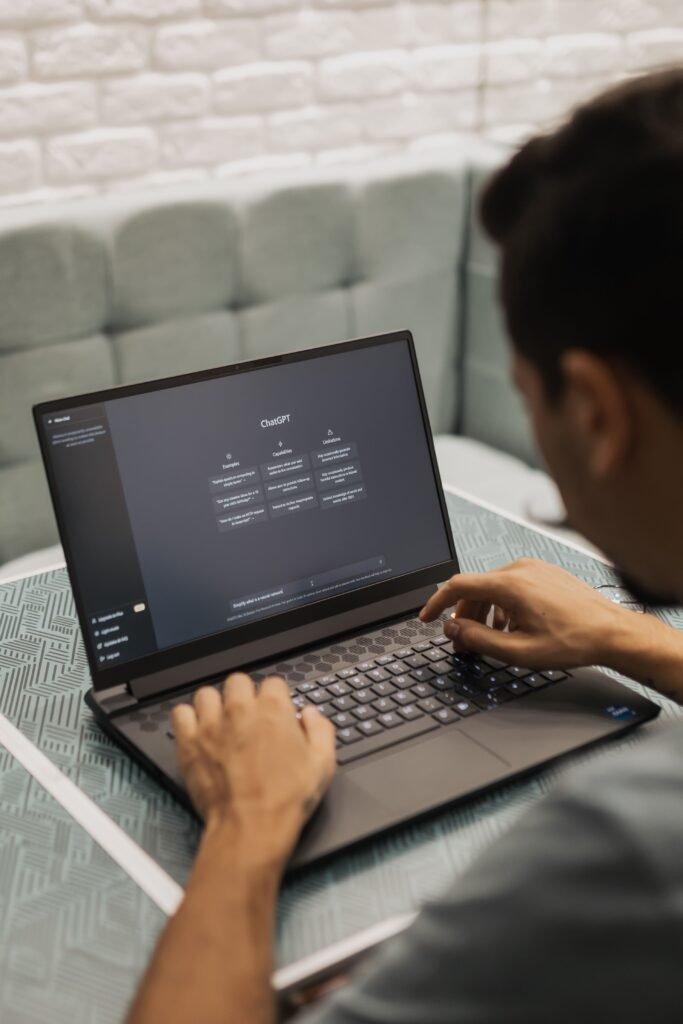 Small business owner using AI marketing tools on a laptop